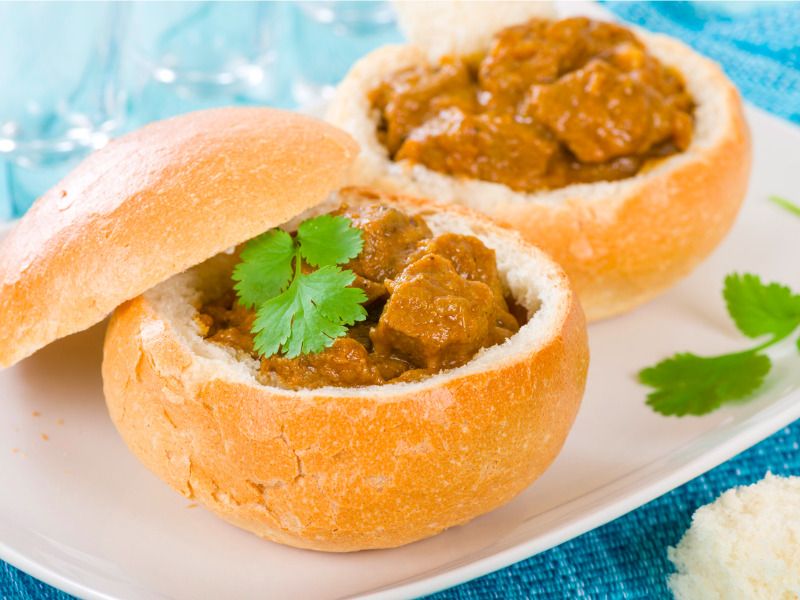 Bunny Chow curry Cape Town food — © Paul Brighton / iStock.
