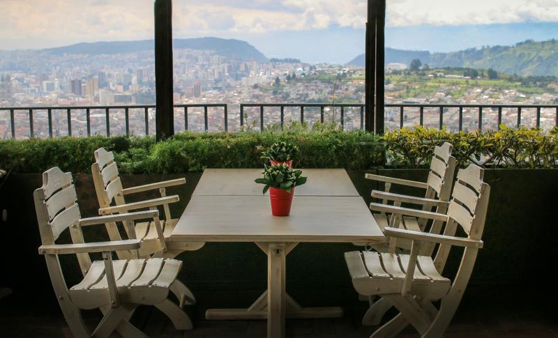 Panoramic city view over Quito from Pim’s outdoor deck — © Restaurante Pim’s.