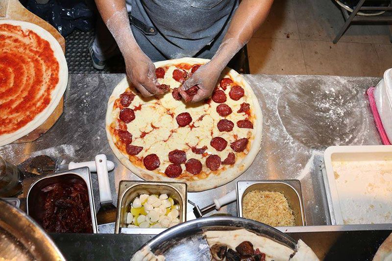 Hells Pizza slice in Buenos Aires — © Hell’s Pizza.