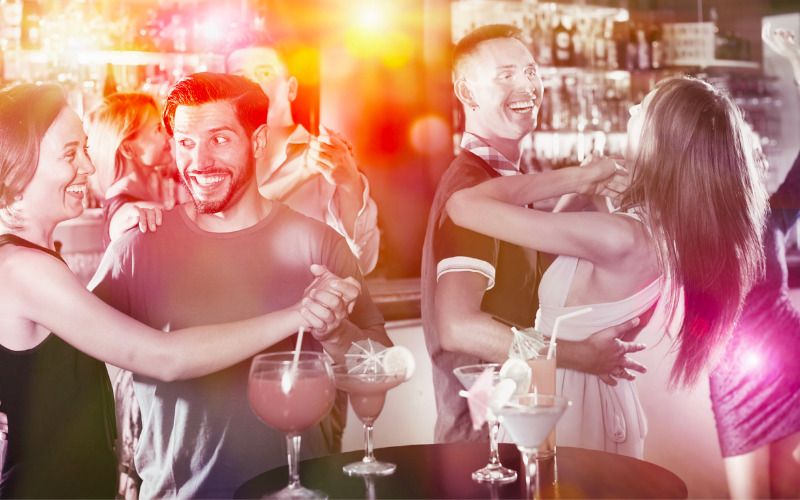 Salsa dancing in a bar — © JackF / iStock.