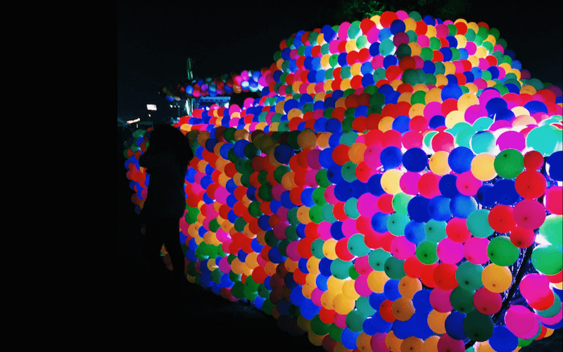 Tank crafted out of neon balloons at Estereo Picnic — © Nick Anderson.