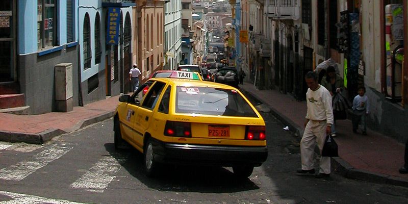 Registered yellow taxi in Quito — © Philip Schilling.